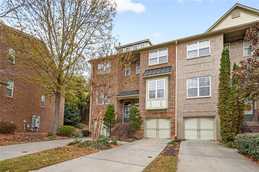 1982 Cobblestone Circle Northeast Brookhaven, GA 30319 - Photo 51 of 51 a front view of a house with garden