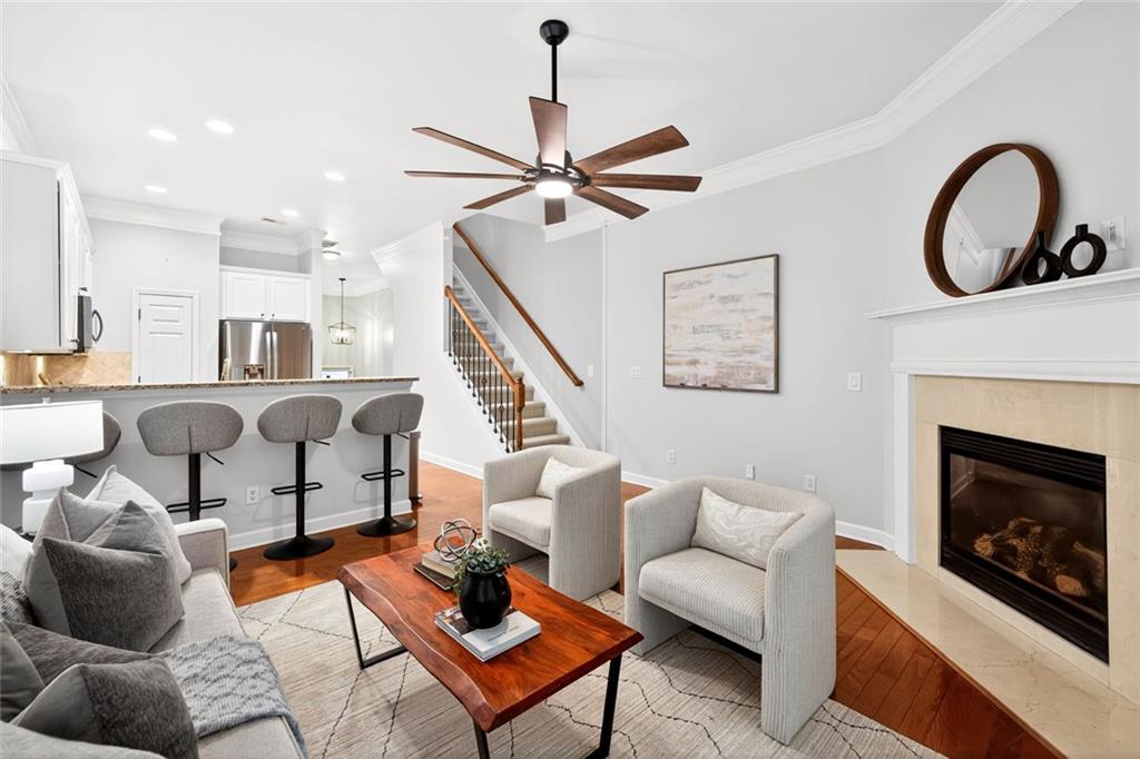 1982 Cobblestone Circle Northeast Brookhaven, GA 30319 - Photo 7 of 51 a living room with furniture a fireplace and a flat screen tv