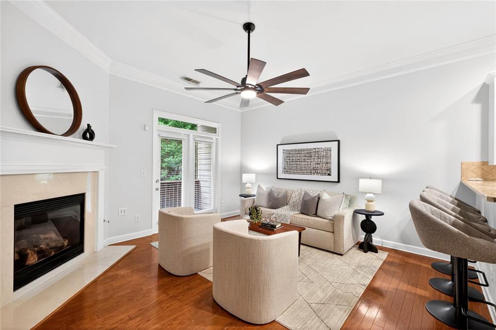 1982 Cobblestone Circle Northeast Brookhaven, GA 30319 - Photo 8 of 51 a living room with furniture a window and a fireplace
