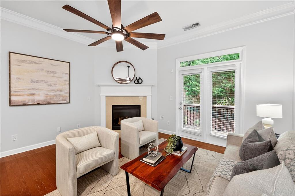 1982 Cobblestone Circle Northeast Brookhaven, GA 30319 - Photo 9 of 51 a living room with furniture a fireplace and a large window