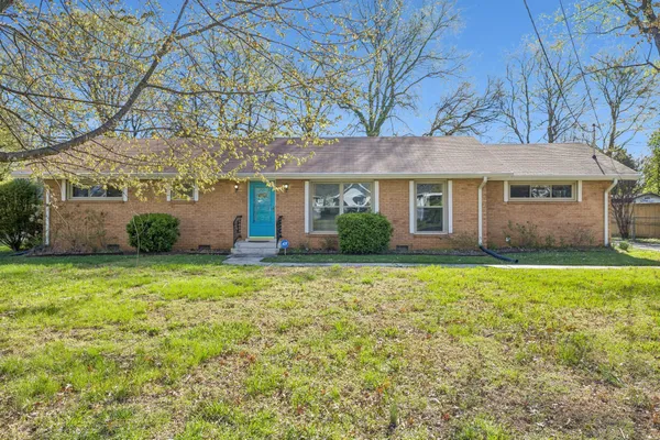 front view of a house with a yard