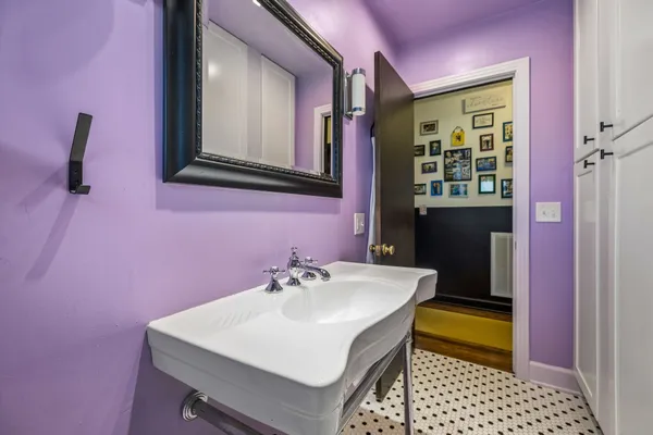 a bathroom with a sink and a mirror