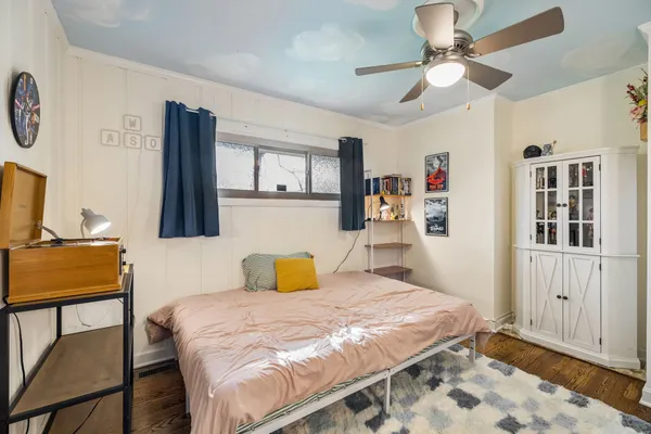 a bedroom with a bed and a table in it