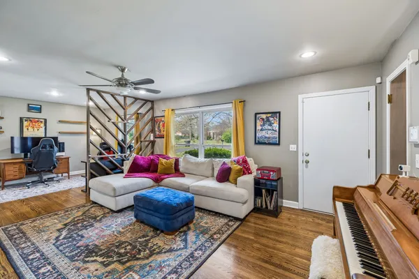 a living room with furniture and a rug