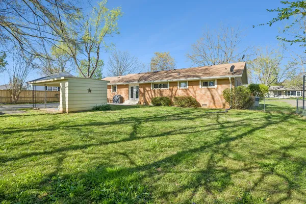 a view of front of house with a yard