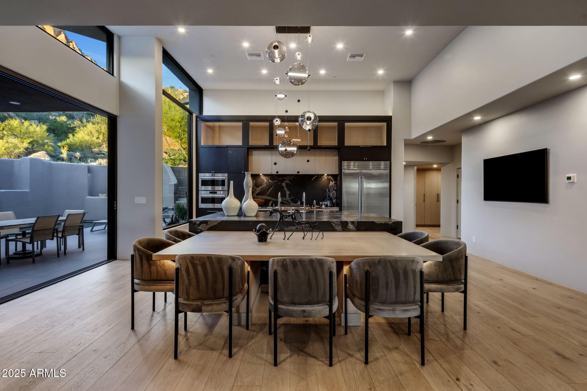 10040 East Happy Valley Road, Unit 1039 Scottsdale, AZ 85255 - Photo 15 of 60 a view of a dining room with furniture and wooden floor