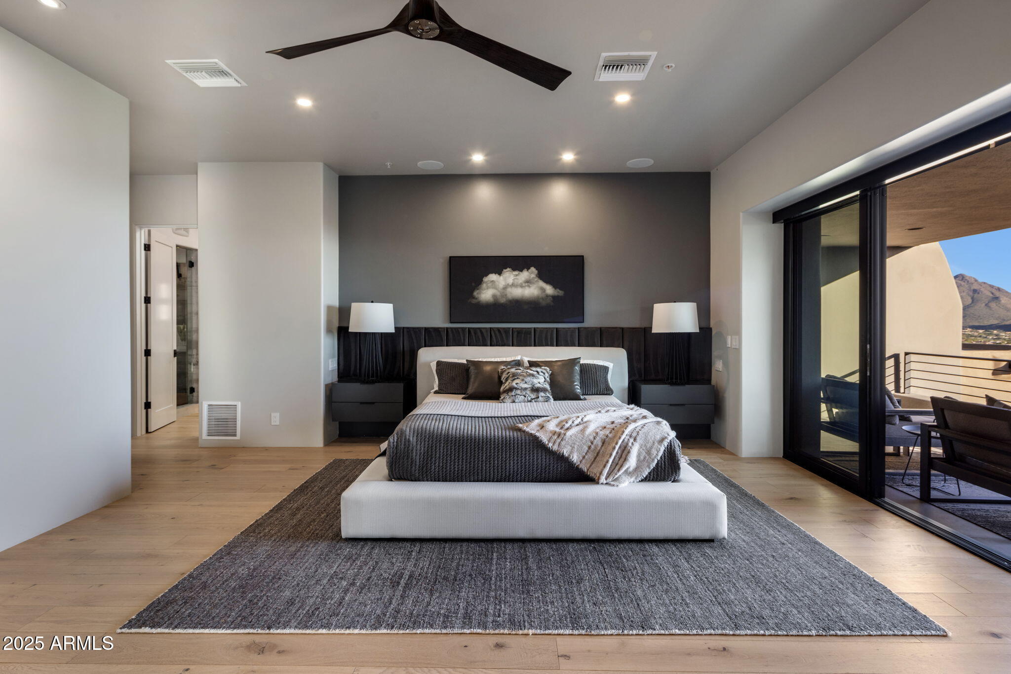 10040 East Happy Valley Road, Unit 1039 Scottsdale, AZ 85255 - Photo 17 of 60 a spacious bedroom with a bed and glass windows