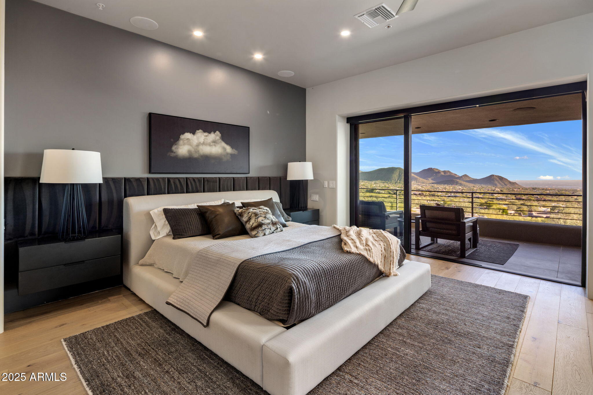 10040 East Happy Valley Road, Unit 1039 Scottsdale, AZ 85255 - Photo 18 of 60 a bedroom with a large bed and a large window