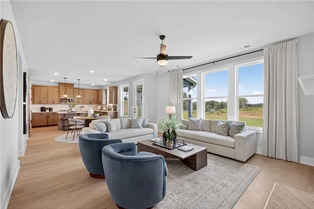 a living room with furniture and a large window