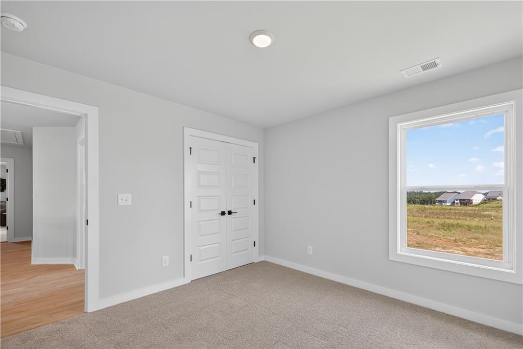 2541 Parkside Way Gainesville, GA 30507 - Photo 26 of 45 a view of an empty room with a window