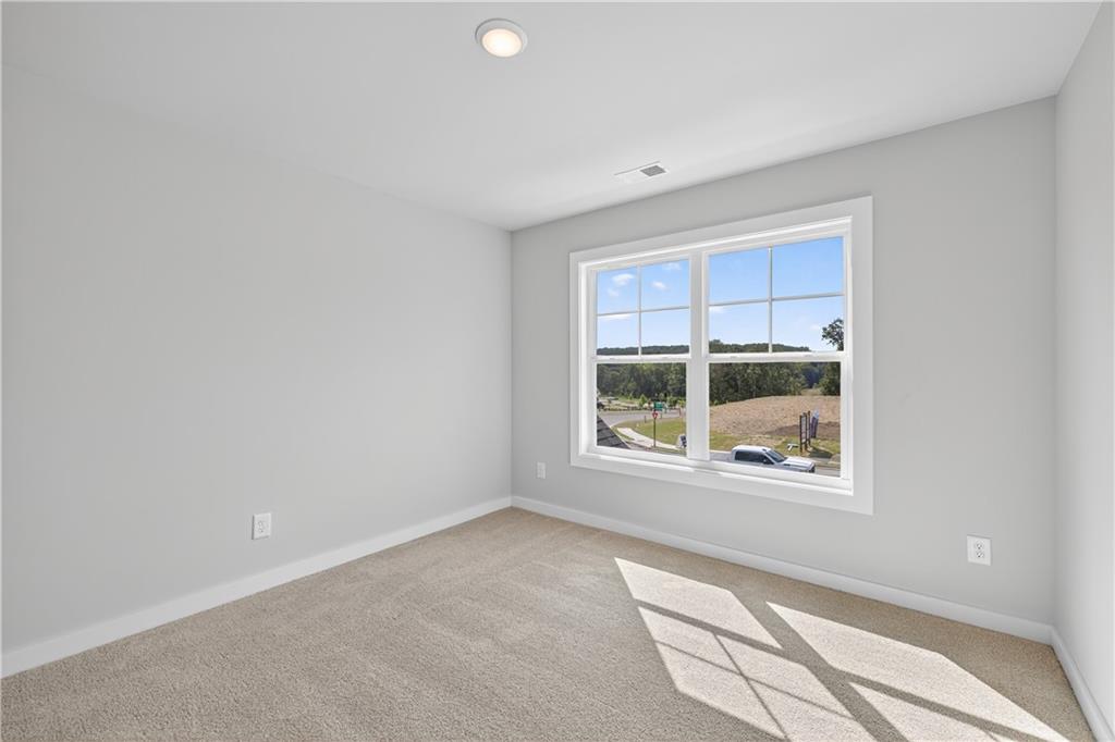 2541 Parkside Way Gainesville, GA 30507 - Photo 32 of 45 a view of an empty room with a window
