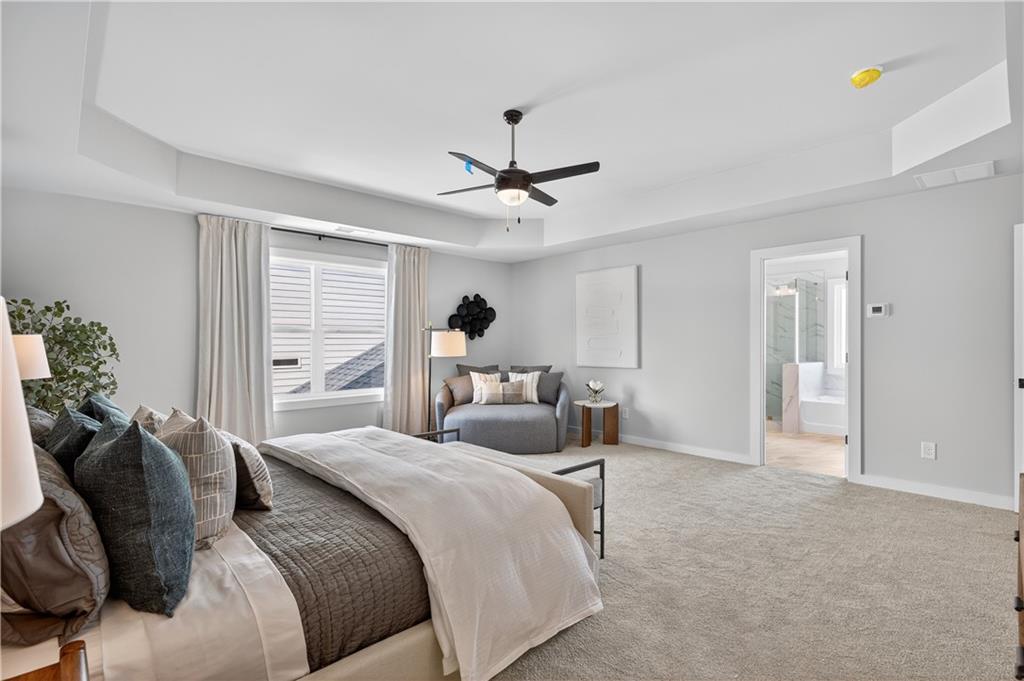 2541 Parkside Way Gainesville, GA 30507 - Photo 35 of 45 a bedroom with a bed and a chandelier
