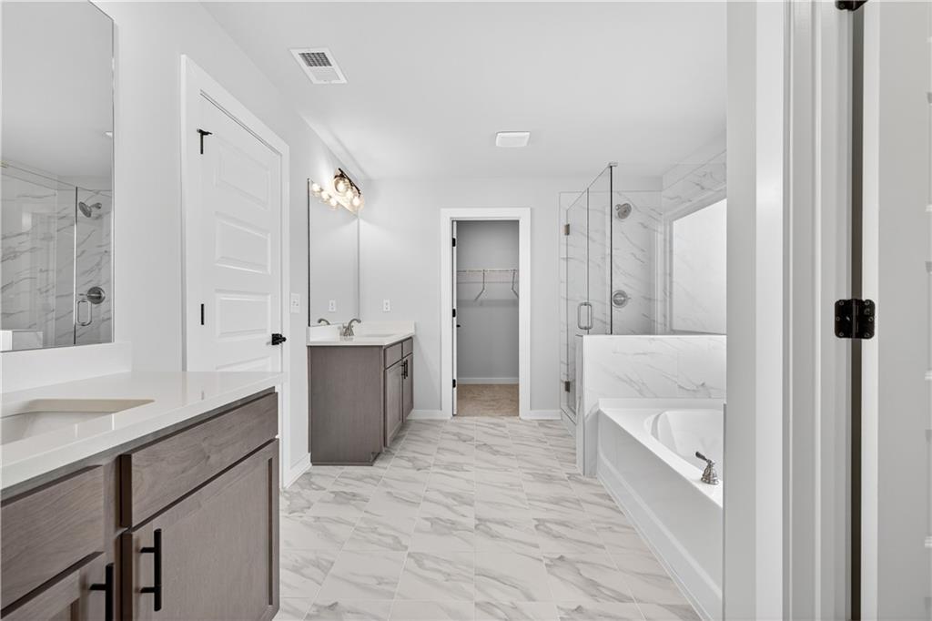 2541 Parkside Way Gainesville, GA 30507 - Photo 39 of 45 a bathroom with a sink a toilet and shower