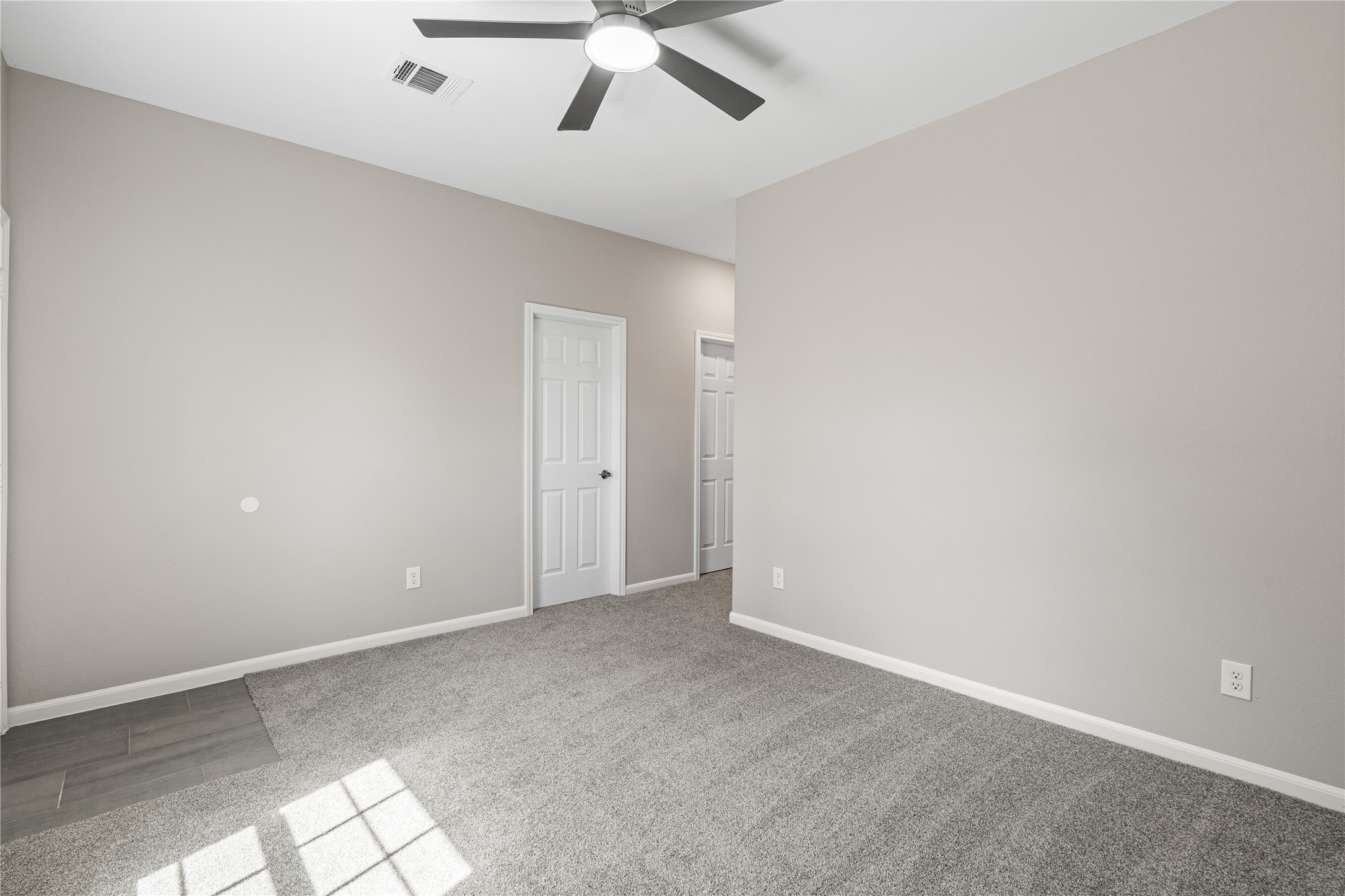 142 Calloway Street, Unit A Houston, TX 77029 - Photo 15 of 23 an empty room with a ceiling fan and carpet