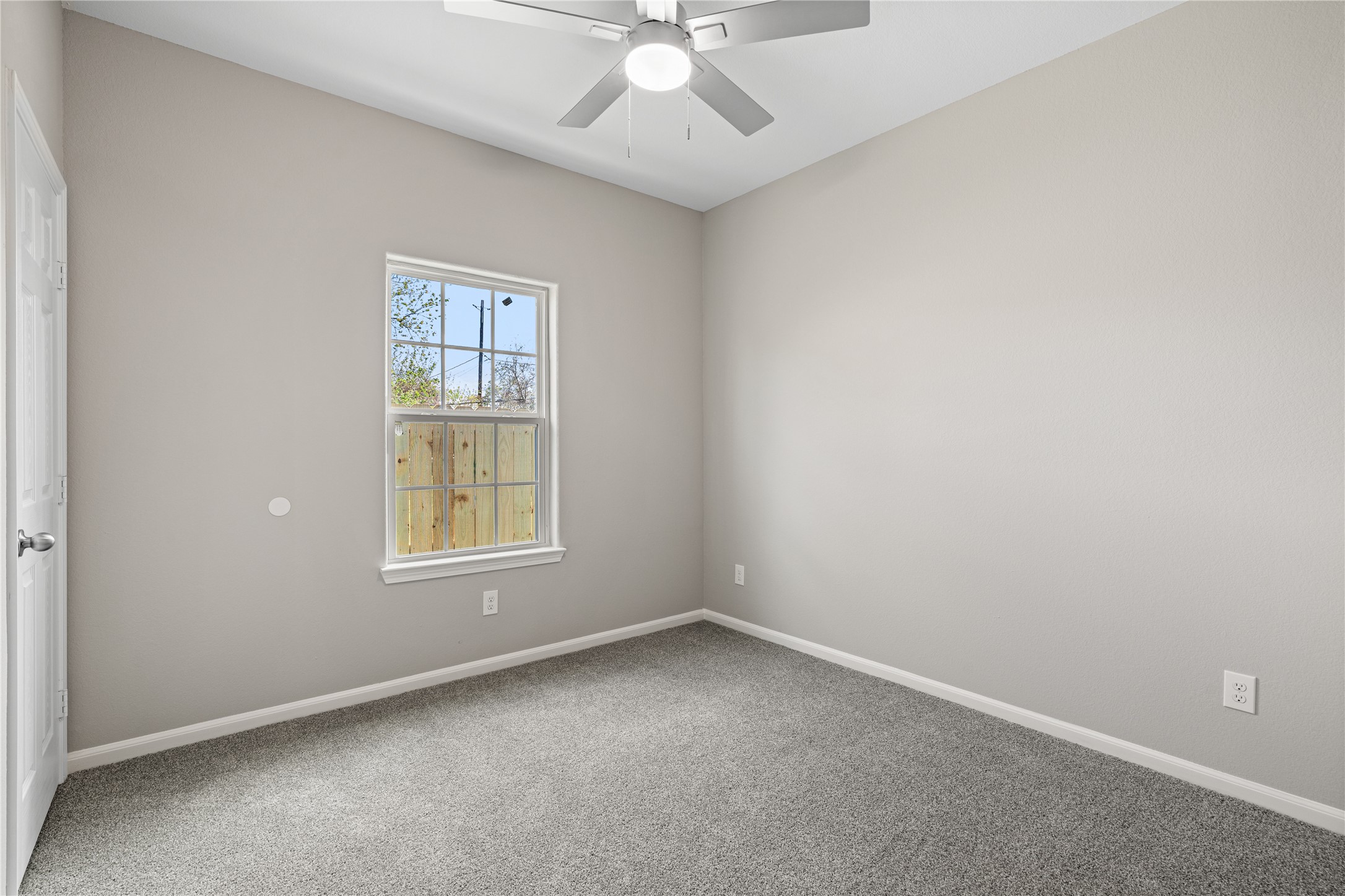 142 Calloway Street, Unit A Houston, TX 77029 - Photo 19 of 23 an empty room with a window and a fan
