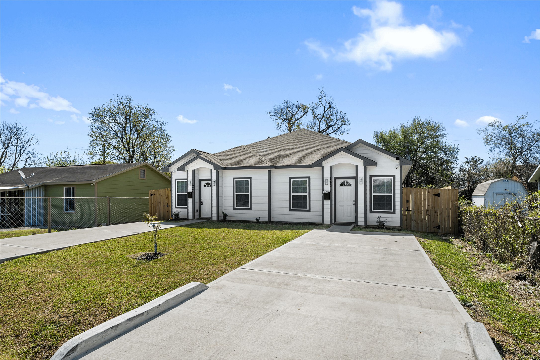 142 Calloway Street, Unit A Houston, TX 77029 - Photo 2 of 23 a front view of a house with a yard and garage