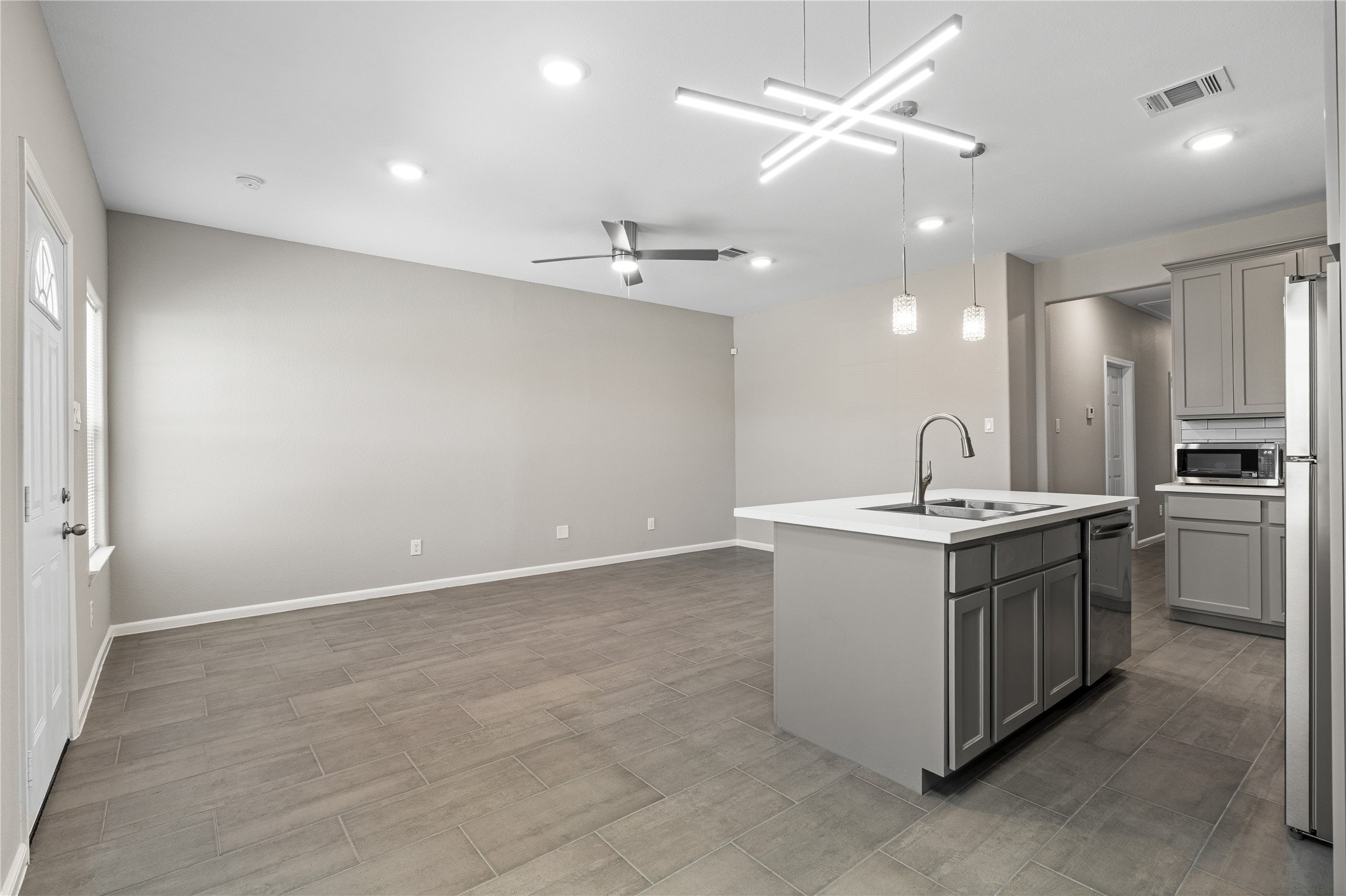 142 Calloway Street, Unit A Houston, TX 77029 - Photo 10 of 23 a kitchen with a sink stove and refrigerator