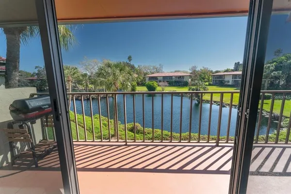 a view of a balcony with wooden floor