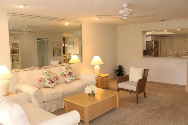a living room with furniture and white walls