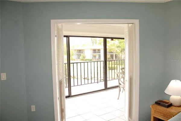 a bathroom with a granite countertop sink mirror vanity and toilet