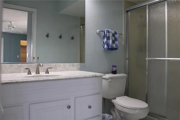 a bathroom with a shower and toilet