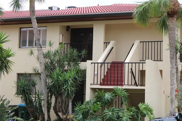 a view of balcony with potted plants