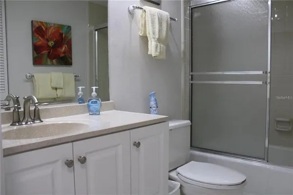 a bathroom with a bathtub and a sink