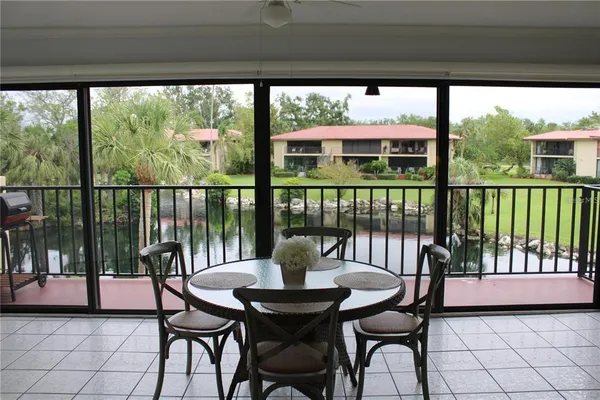 a dining room with furniture window and outside view