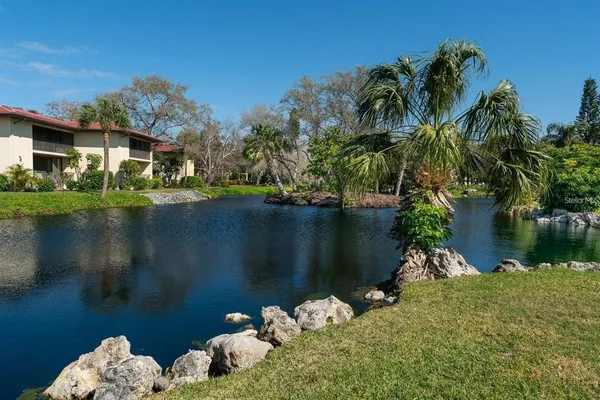 a view of a swimming pool with a lake view