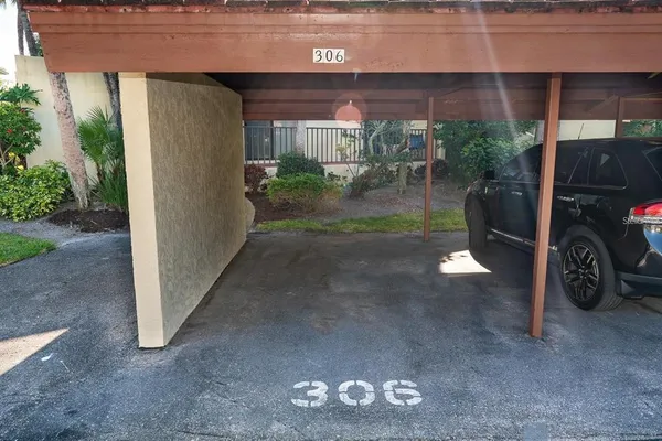 an aerial view of a house with swimming pool garden and patio