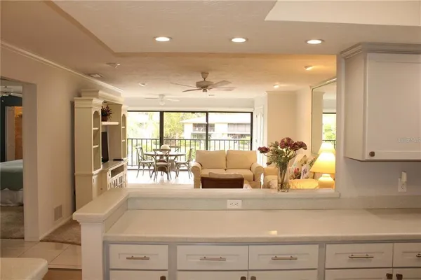 a living room with furniture and large windows