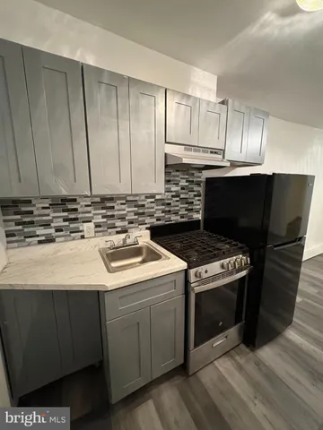 a kitchen with a stove and a microwave