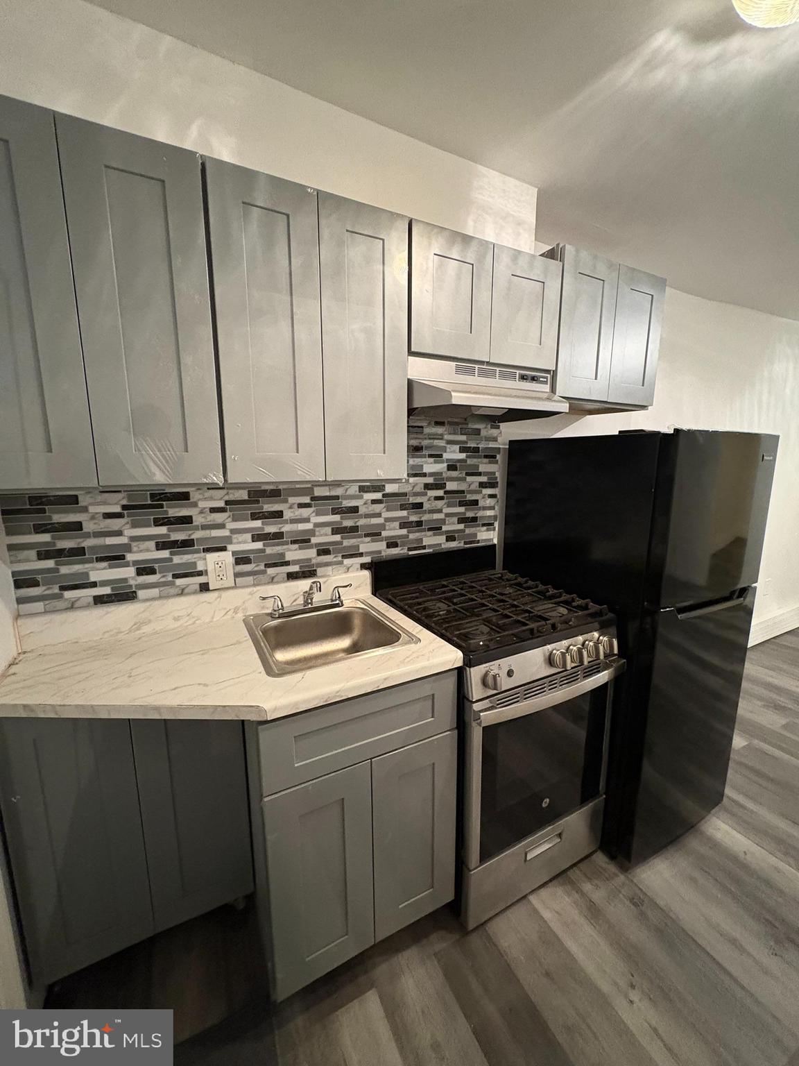 a kitchen with a stove and a microwave