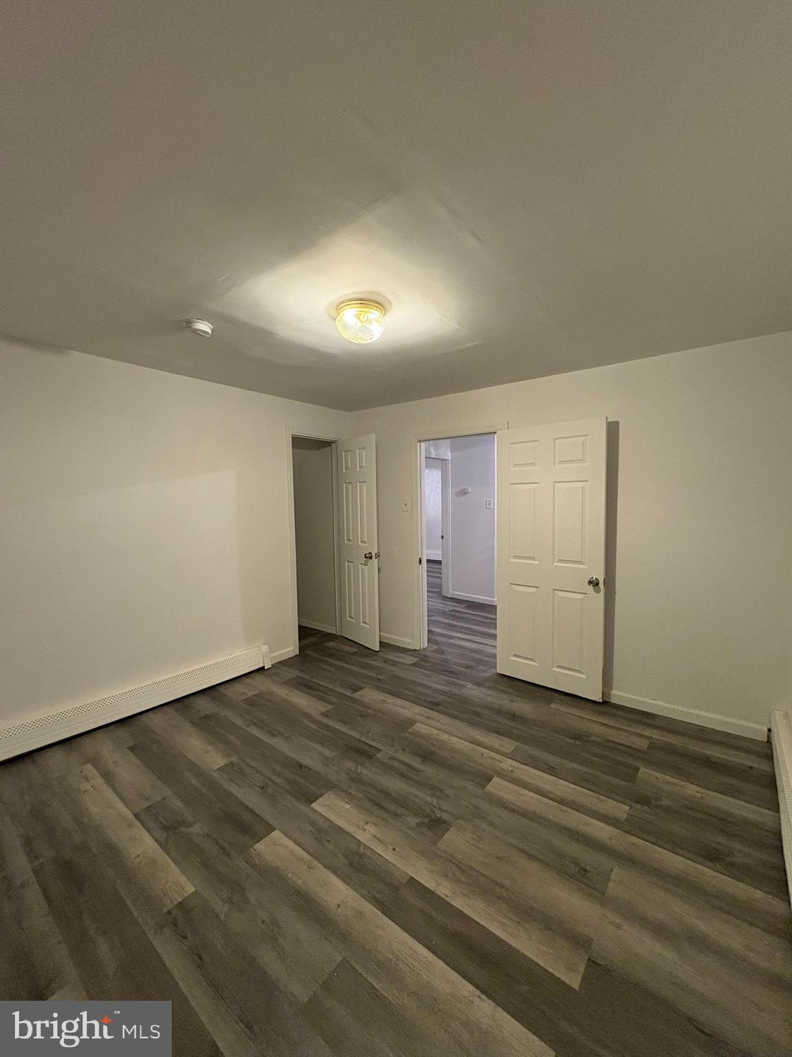 38 Broadway, Unit C Laurel Springs, NJ 08021 - Photo 12 of 15 a view of an empty room with wooden floor