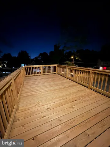 a balcony view with a wooden floor