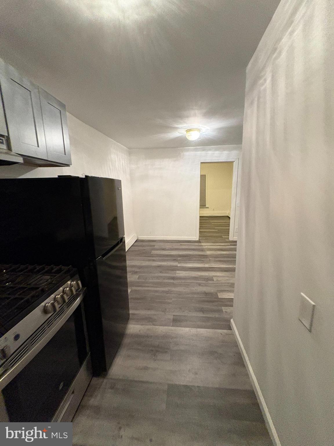 38 Broadway, Unit C Laurel Springs, NJ 08021 - Photo 2 of 15 a view of an empty room and wooden floor