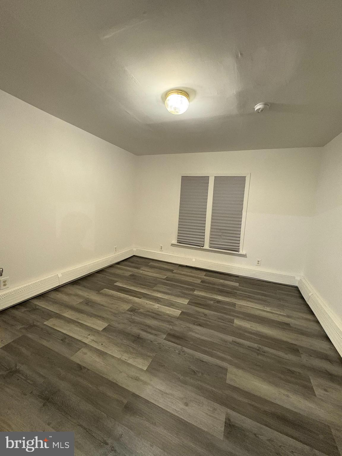 38 Broadway, Unit C Laurel Springs, NJ 08021 - Photo 10 of 15 a view of empty room with wooden floor