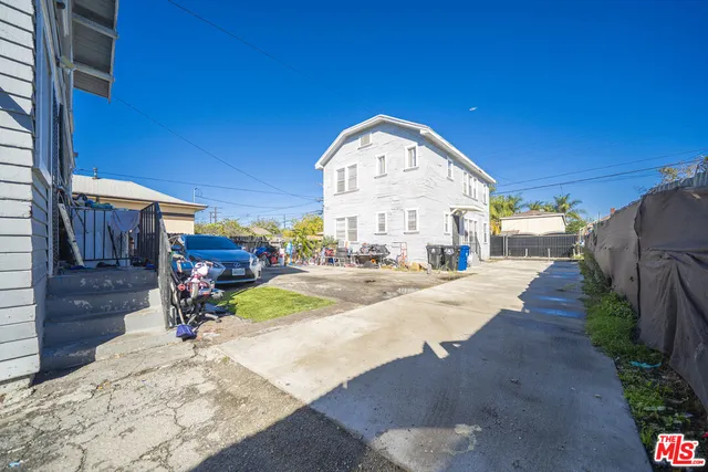 a view of a swimming pool with a slide in a patio