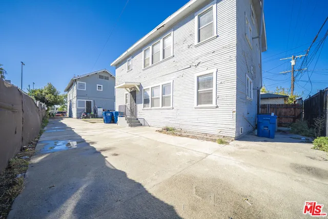 a view of a house with a snow in the yard