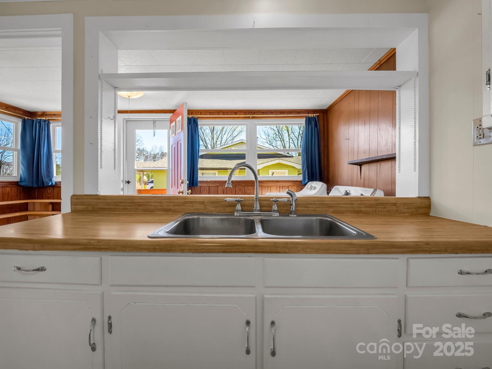 34 Manus Chapel Road Mill Spring, NC 28756 - Photo 19 of 42 a kitchen with a sink and a large window