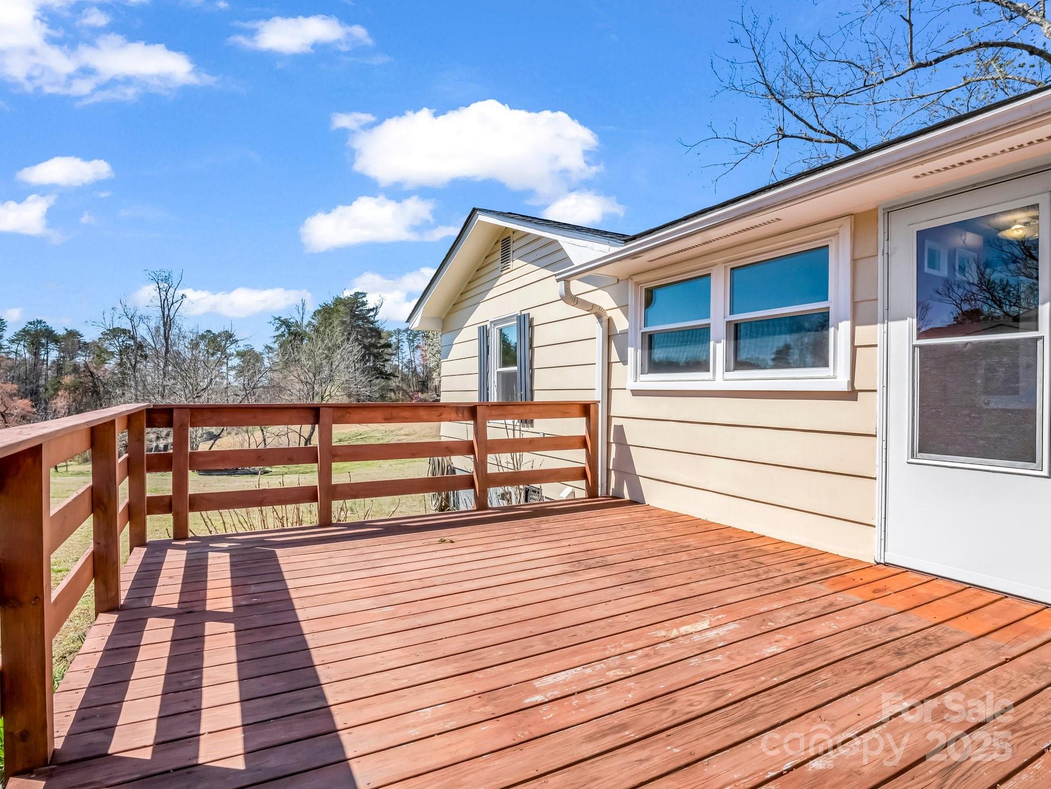 34 Manus Chapel Road Mill Spring, NC 28756 - Photo 23 of 42 a view of a house with a roof deck