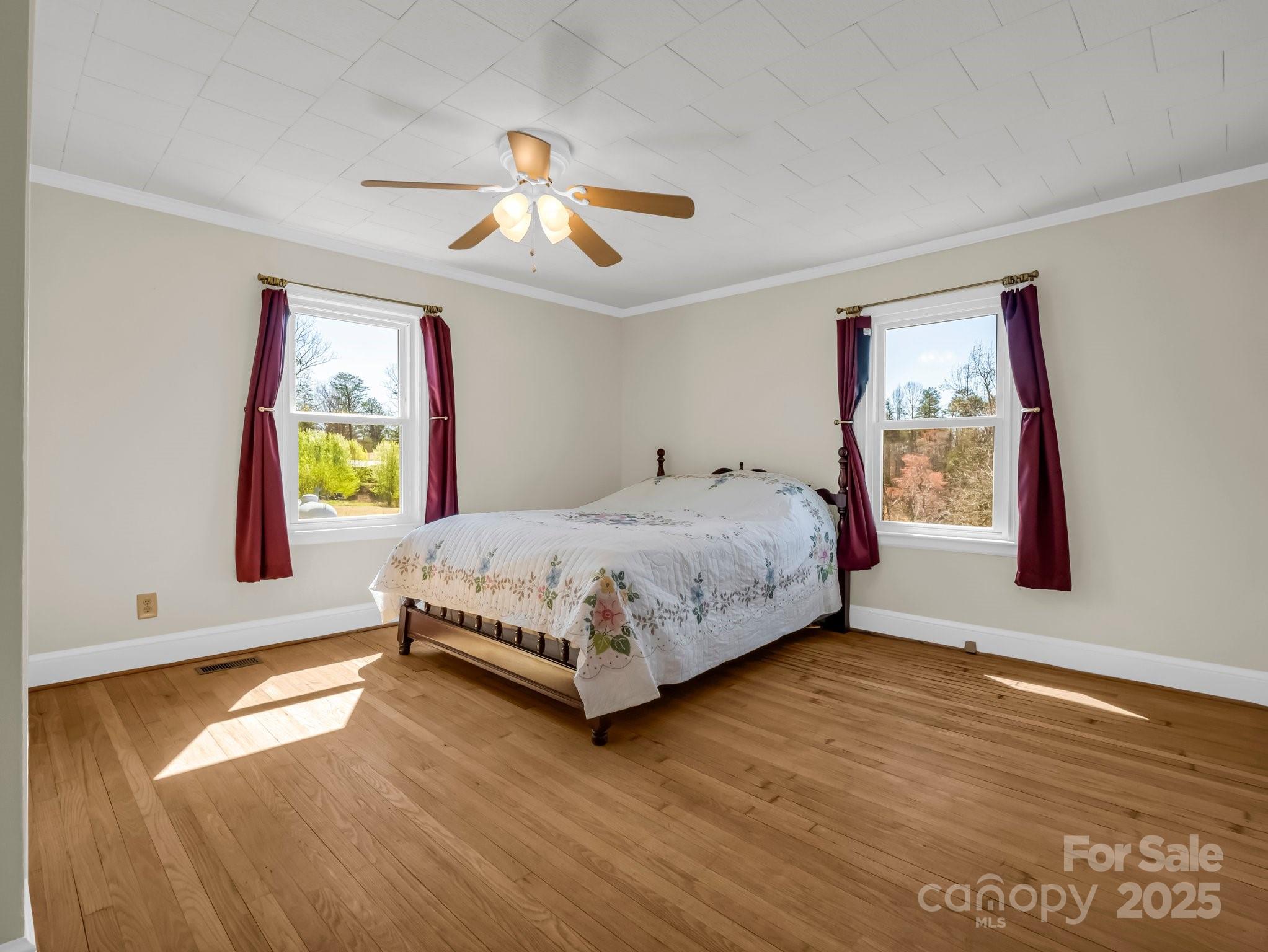 34 Manus Chapel Road Mill Spring, NC 28756 - Photo 28 of 42 a bedroom with a bed and a painting on the wall