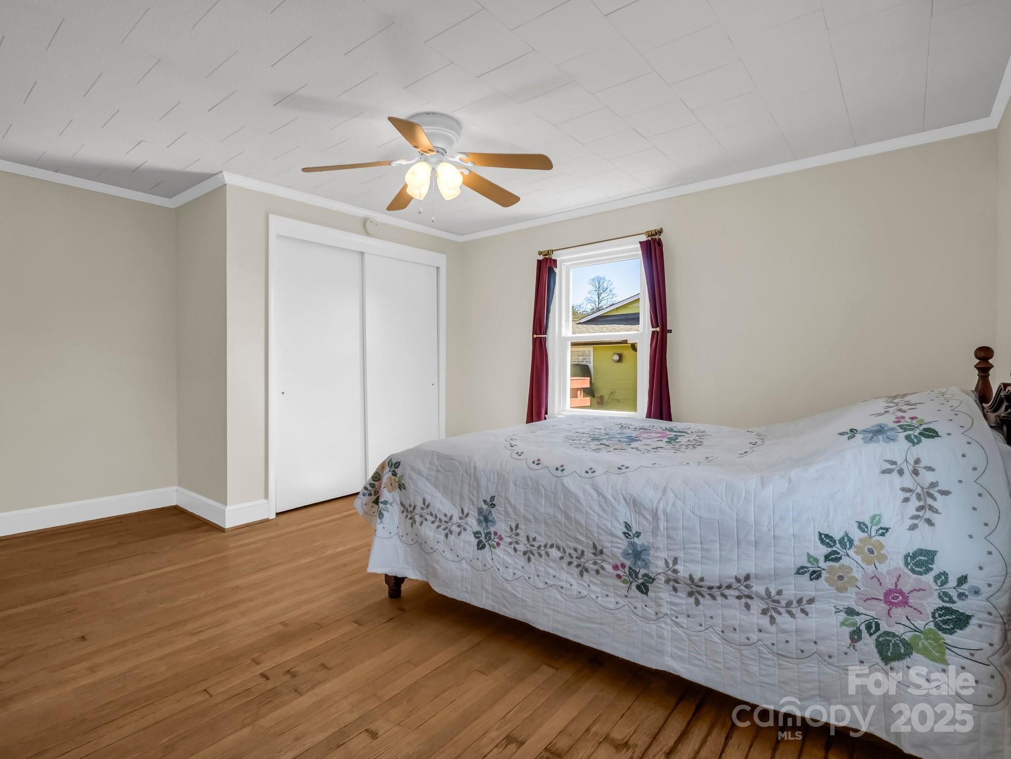34 Manus Chapel Road Mill Spring, NC 28756 - Photo 30 of 42 a bedroom with a bed and a window