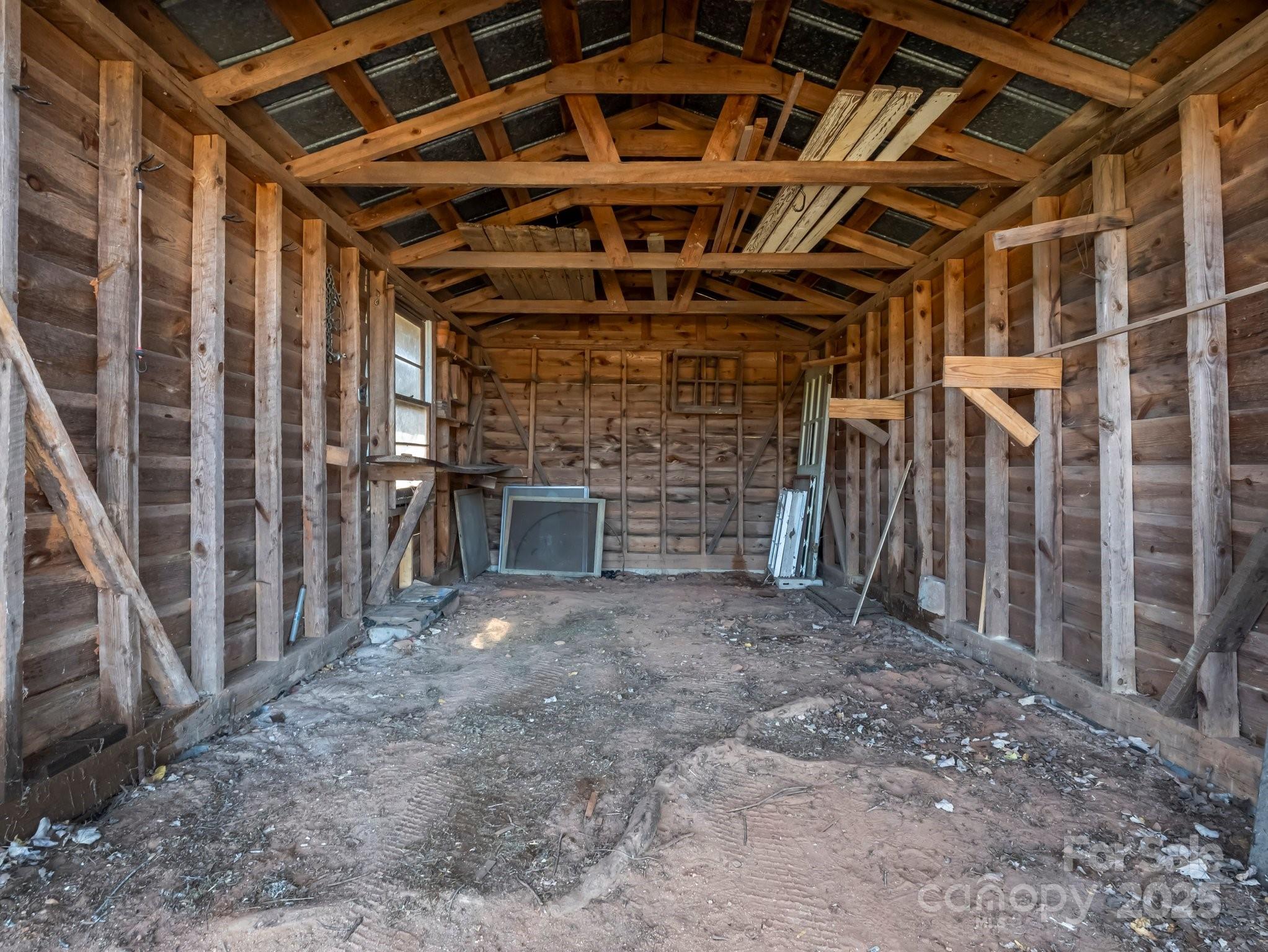34 Manus Chapel Road Mill Spring, NC 28756 - Photo 33 of 42 a view of an empty room with wooden walls
