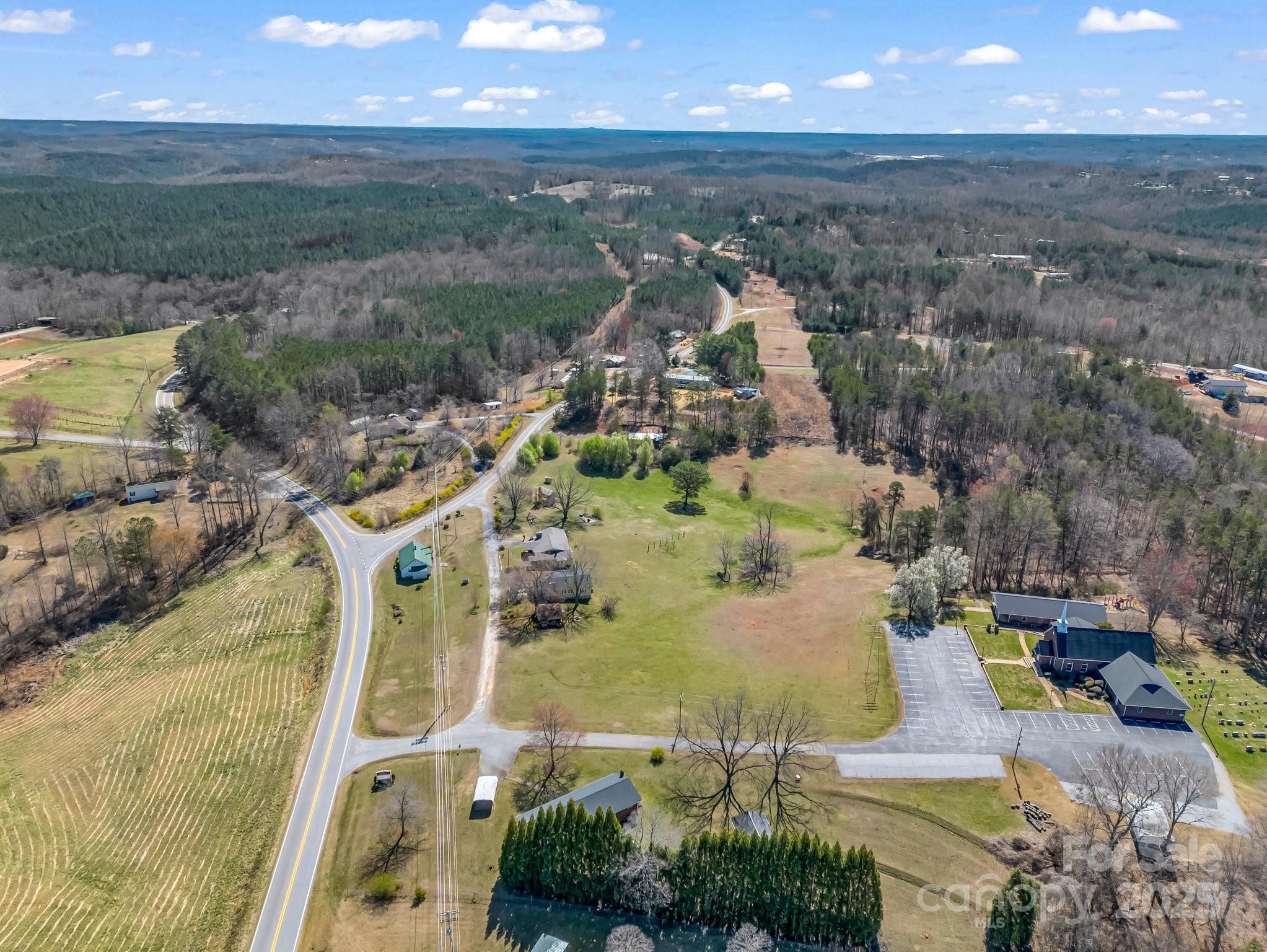 34 Manus Chapel Road Mill Spring, NC 28756 - Photo 40 of 42 an aerial view of a house with a yard and lake view