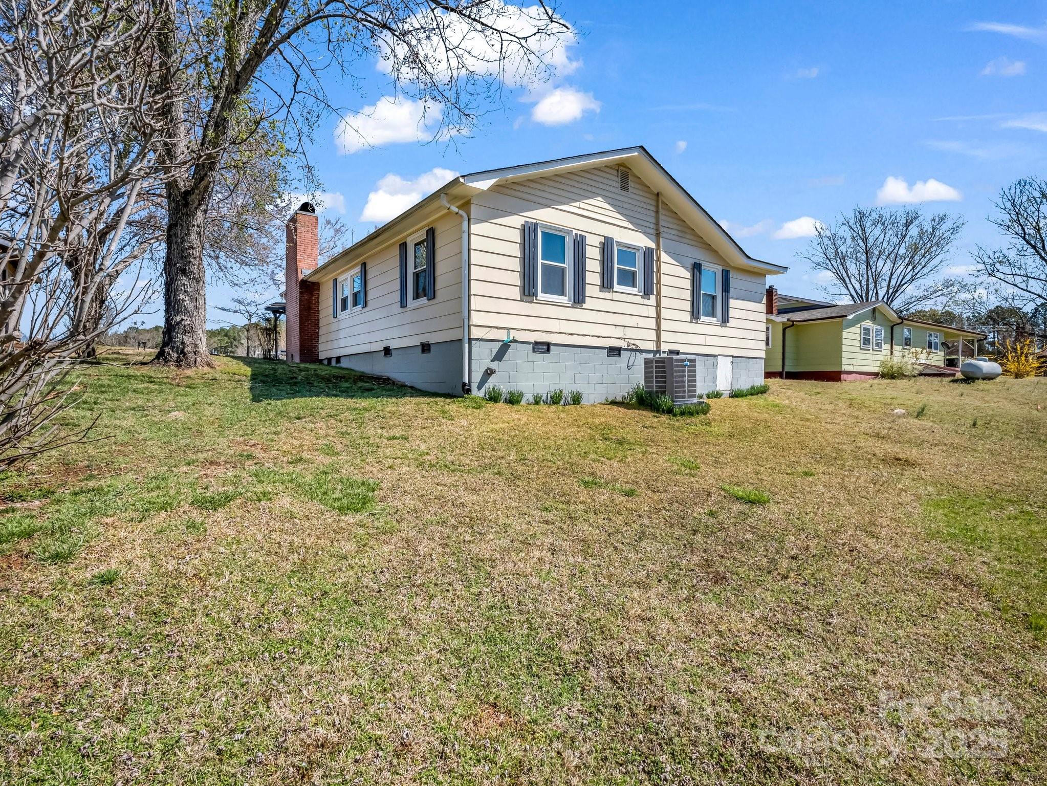34 Manus Chapel Road Mill Spring, NC 28756 - Photo 6 of 42 a front view of a house with a big yard
