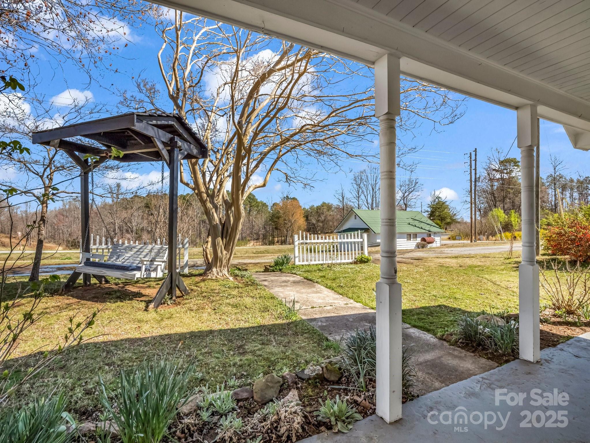 34 Manus Chapel Road Mill Spring, NC 28756 - Photo 8 of 42 a view of a patio with a yard