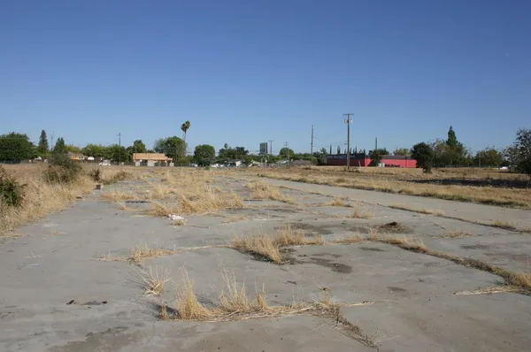 a view of a lake with houses in the background