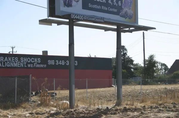 a view of a dry yard covered with snow