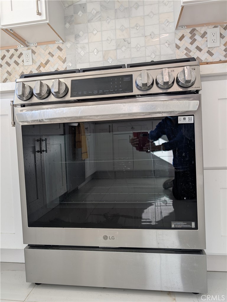 10452 Circulo De Juarez Fountain Valley, CA 92708 - Photo 13 of 34 a closeup stove top oven